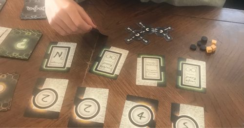 teens playing "Covalence" board game