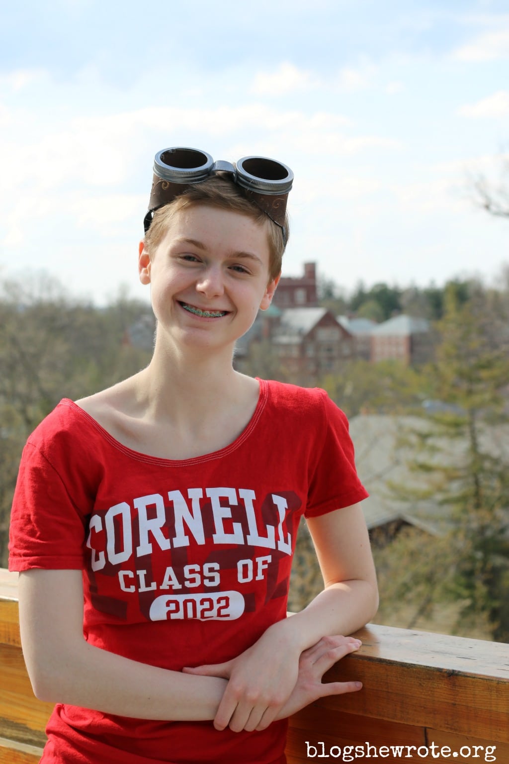 Homeschooling for College by Design at BlogSheWrote.org Newly accepted freshman at Cornell wearing a tshirt class of 2022